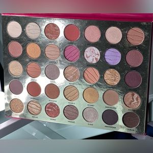 Eyeshadow palette has been swatched on a couple